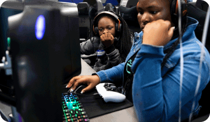 young people gaming with headphones on