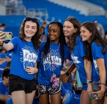 girls wearing UK shirts take selfie